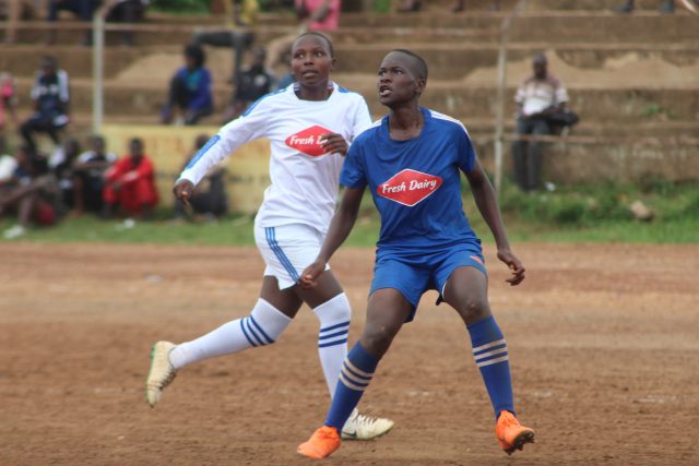 Mukono High School's Fauzia Najjemba (blue) netted thrice against Pride Mixed on Thursday